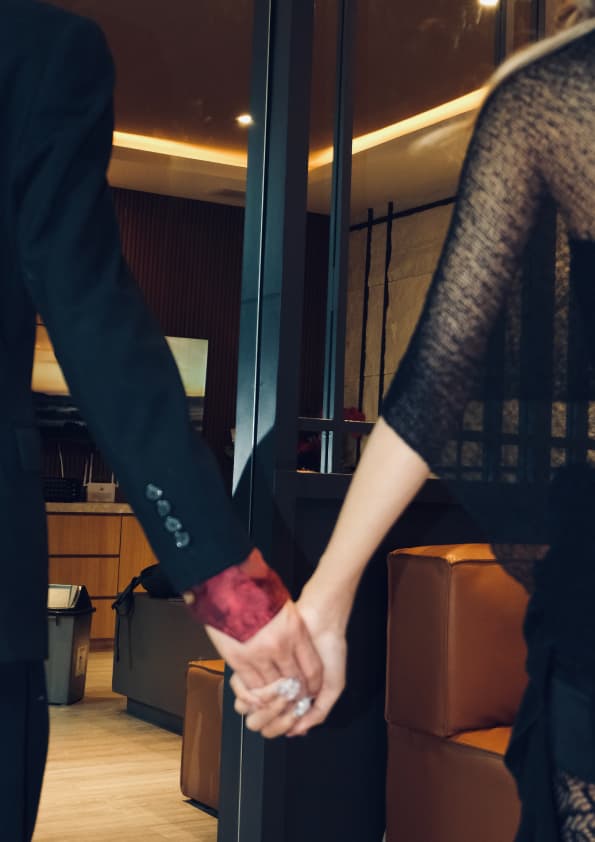 Just our hands, held, at the edge of the frame