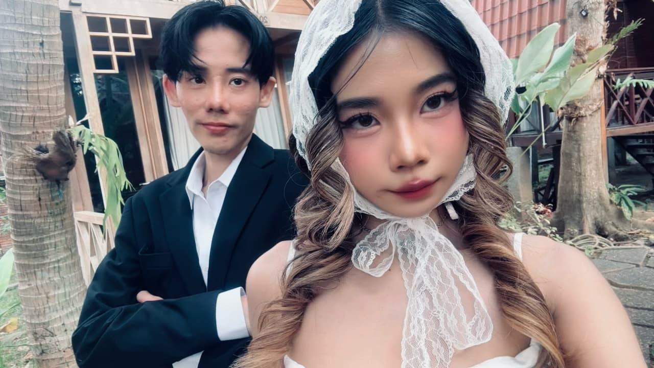 The two of us outside, her veiled, him in his suit